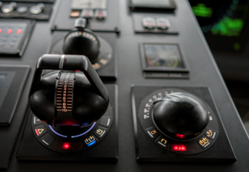 Close-up of two joystick-style control levers 